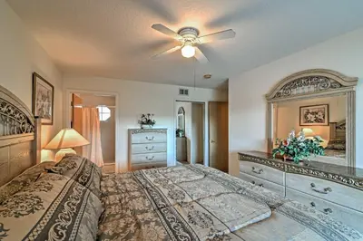 a bedroom with a bed and a ceiling fan at Close to Disney and Resort Perks Kissimmee Condo in Kissimmee