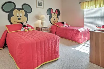 a bedroom with two beds with stuffed animals on them at 4 Mi to Disney Kissimmee Group Getaway in Orlando