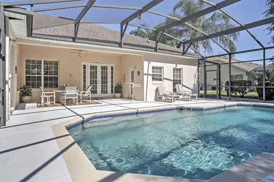 a swimming pool in the backyard of a home at 4 Mi to Disney Kissimmee Group Getaway in Orlando