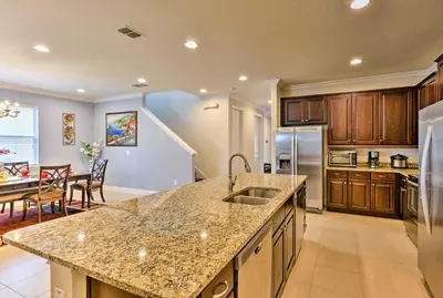 a kitchen with a sink and a counter top at 5 Mi to Disney Oasis with Pool and Patio in Orlando