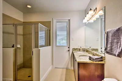 a bathroom with a shower and a sink at 5 Mi to Disney Oasis with Pool and Patio in Orlando