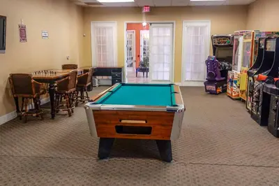 a room with a pool table and a dining room at Kissimmee Retreat with Pool Access Less Than 4 Mi to Disney! in Orlando