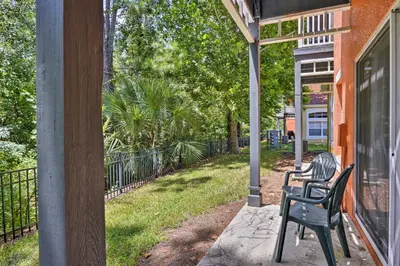 two chairs sitting on the porch of a house at 5 Mi to Disney Emerald Island Resort Condo! in Kissimmee