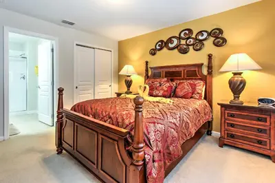 a bedroom with a large bed and two lamps at Spacious Kissimmee Villa - 3 Mi to Disney World! in Orlando