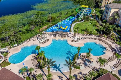 an aerial view of a pool at a resort at Spacious Kissimmee Villa - 3 Mi to Disney World! in Orlando