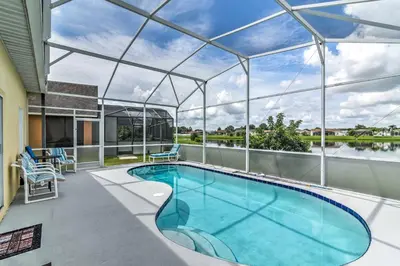 an indoor swimming pool with a glass roof at Kissimmee Retreat with Pool Near Disney and Golf! in Kissimmee
