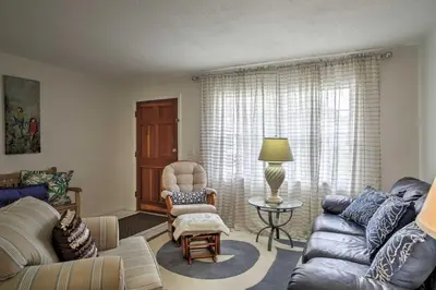 a living room with a couch and a chair at Spacious Central Florida Home Family Friendly! in Orlando