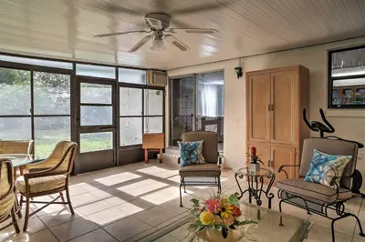 a living room with chairs and a ceiling fan at Spacious Central Florida Home Family Friendly! in Orlando