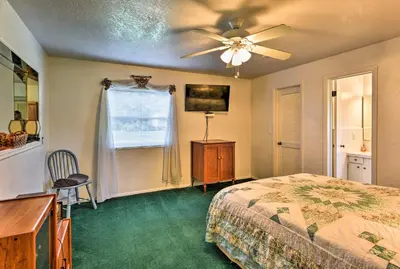 a bedroom with a bed and a ceiling fan at Sandford Vacation Rental Near Airport and Lake! in Sanford