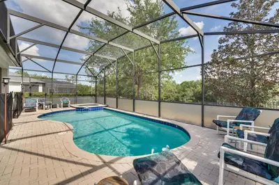 an indoor swimming pool with a glass roof at Spacious Home in Gated Resort, 2 Mi to Disney! in Orlando