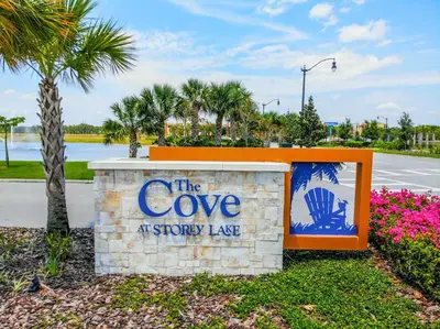 a sign for the cove atstory lake at a resort at Lovely 2BR Codo with 2Clubhouses & Kids Splash Pad in Kissimmee