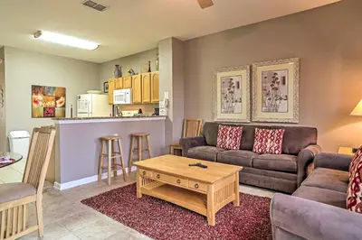 a living room with a couch and a table at Our Mickey Mouse House Townhome with Pool! in Orlando
