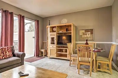 a living room with a couch and a table at Our Mickey Mouse House Townhome with Pool! in Orlando