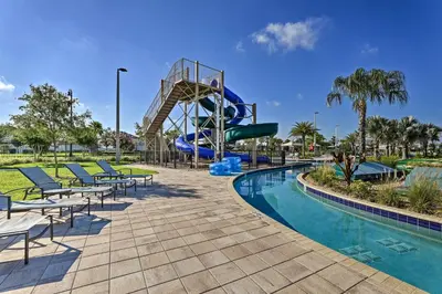 a water park with a slide and a pool at about 6 Mi to Disney Kissimmee Retreat with Pool! in Kissimmee