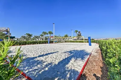 a volleyball court on the beach with a blue sky at about 6 Mi to Disney Kissimmee Retreat with Pool! in Kissimmee
