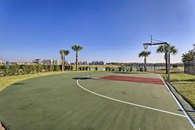 a basketball court with palm trees and a hoop at about 6 Mi to Disney Kissimmee Retreat with Pool! in Kissimmee
