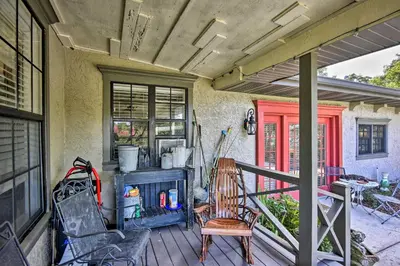a porch with chairs and a fireplace on a house at Lake Marion Apt with Canoe in Altamonte Springs! in Orlando