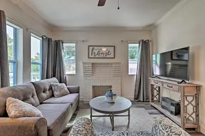 a living room with a couch and a fireplace at Walk to Dtwn Winter Garden Home with Patio in Orlando