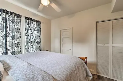 a bedroom with a bed and a ceiling fan at Walk to Dtwn Winter Garden Home with Patio in Orlando