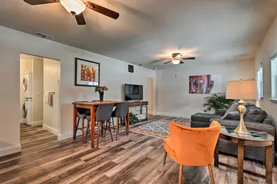 a living room with a couch and a table at Walkable Winter Garden Bungalow 3 Blocks to Dtwn in Orlando