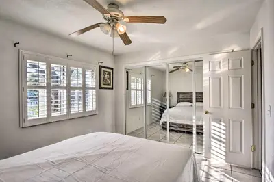 a bedroom with a bed and a ceiling fan at Kissimmee Home 5 Mi to Gatorland and 15 Mi to Disney in Kissimmee