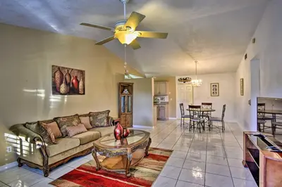a living room with a couch and a ceiling fan at Kissimmee Home 5 Mi to Gatorland and 15 Mi to Disney in Kissimmee