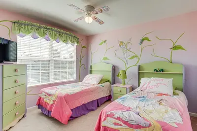 two beds in a girls bedroom with pink walls at 3 Mi to WDW Windsor Hills Home with Game Room! in Orlando