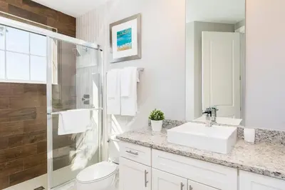 a white bathroom with a sink and a shower at 5min Disney Wonderful Villa, BBQ, SMV102 in Orlando