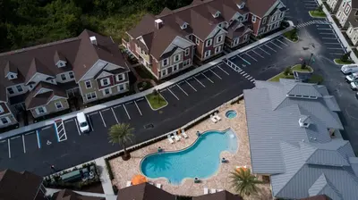 an aerial view of a house with a swimming pool at 4 BR 4 BA Deluxe Villa 5 min to Disney Family getaway in Orlando