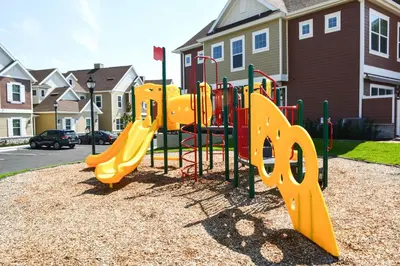 a playground with a yellow slide in a park at 5min Disney Fantastic Family Villa SMV113 in Orlando