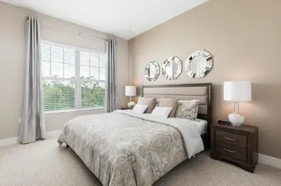 a bedroom with a large bed and a window at Gorgeous Family Villa 114 in Orlando