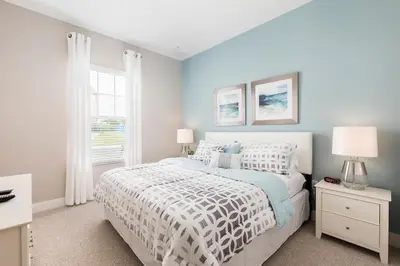 a bedroom with a white bed and a window at Gorgeous Family Villa 114 in Orlando