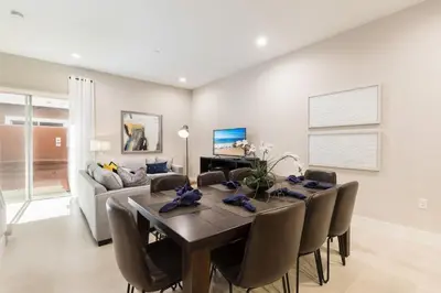 a dining room with a table and chairs at Comfy Villa 5 Min to Dinsey! Hot Tub & BBQ in Orlando