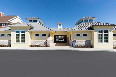 a house with a metal roof at Comfy Villa 5 Min to Dinsey! Hot Tub & BBQ in Orlando