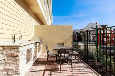 a patio with a table and chairs on a balcony at Precious Townhome w BBQ 131 in Orlando