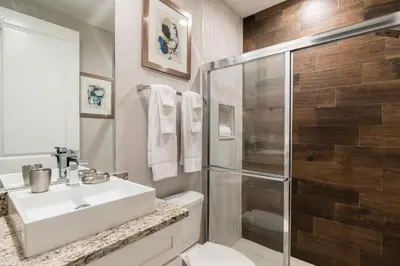 a bathroom with a white sink and a shower at Precious Townhome w BBQ 131 in Orlando