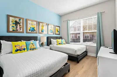 a bedroom with two beds and a television at 5min to Disney Spacious Family Villa SMV135 in Orlando