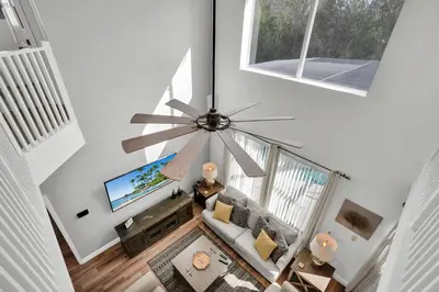 an overhead view of a living room with a ceiling fan at Large 6BR Themed Family Villa Near Disney world in Kissimmee