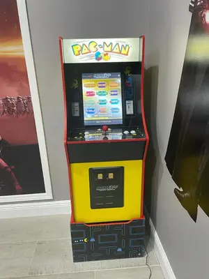 a yellow arcade video game machine in a room at Large 6BR Themed Family Villa Near Disney world in Kissimmee