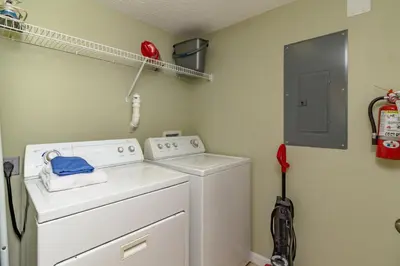 a small laundry room with a washer and dryer at Emerald Island-RU1029 in Kissimmee