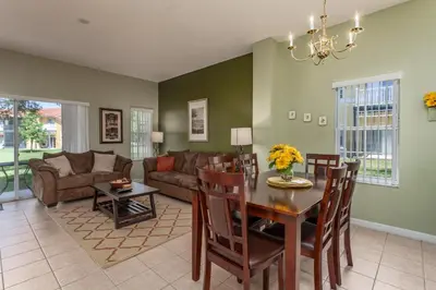 a living room with a table and a couch at Emerald Island-RU1029 in Kissimmee