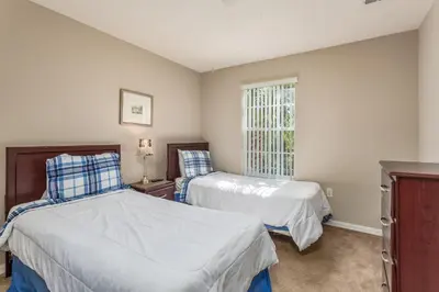 a bedroom with two beds and a window at Emerald Island-RU1029 in Kissimmee