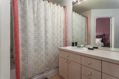 a bathroom with a sink and a shower curtain at Windsor Palms-RU831 in Kissimmee