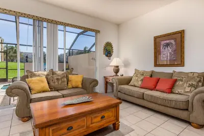 a living room with two couches and a coffee table at Windsor Palms-RU831 in Kissimmee