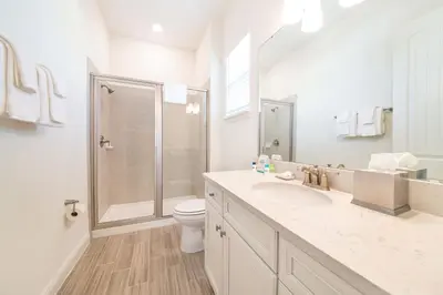 a bathroom with a shower and a sink and a toilet at Sea Breeze Cottage Near Disney With Margaritaville Resort & Island H20 Waterpark Access - 2982La in Orlando