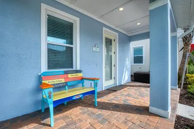 a stack of books sitting on top of a house at Ocean Waves Cottage Near Disney With Margaritaville Resort & Island H20 Waterpark Access - 2983La in Orlando
