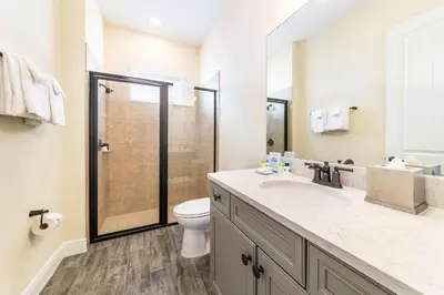 a bathroom with a toilet and a sink and a shower at Smooth Sailing Cottage Near Disney With Margaritaville Resort & Island H20 Waterpark Access - 2978La in Orlando