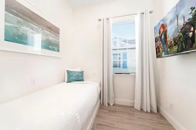 a bedroom with a bed and a window at Margarita Beach House Cottage Near Disney With Private Hot Tub & Island H20 Waterpark Access - 3074Pi in Orlando