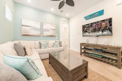 a living room with a couch and a coffee table at Margarita Beach House Cottage Near Disney With Private Hot Tub & Island H20 Waterpark Access - 3074Pi in Orlando