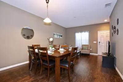 a dining room with a table and chairs at Great townhouse in gated community West Lucaya in Kissimmee